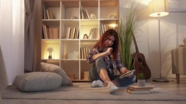 Music inspiration. Dreamful adult woman. Home rest. Pretty casual lady sitting floor living room making notes in light room interior.