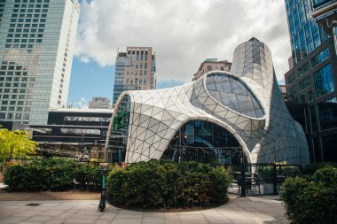 Warsaw, Poland - June 22, 2022: Creative restaurant. Futuristic architecture. Modern city. Cosmic cafe Baraboo in downtown among skyscraper in sunny daylight.