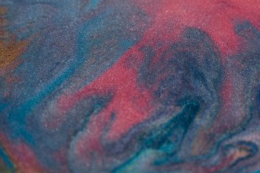 Mixing colors. Fluid magic. Creative painting. Pink blue stream of liquid paint floating. Marble effect