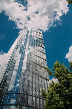 Warsaw, Poland - June 27, 2022: Downtown industry. Skyscraper architecture. City view. Modern high building of M-bank in sunny daylight.