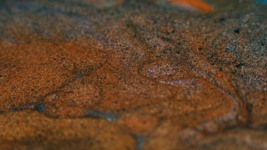 Ink background. Abstract colorful design. Creative paint mixture. Dirty brown sand effect