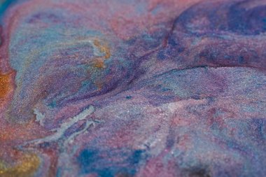 Painting relax. Fluid magic. Creative art. Blue purple fluid paint blend