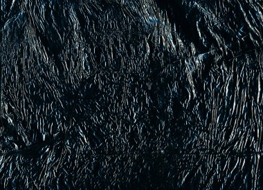 Grunge background. Creased texture. Uneven film structure. Blue white black ripples on distressed rough dark abstract illustration overlay.