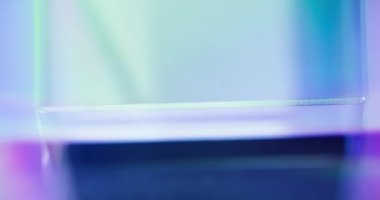 Neon light geometric background. Futuristic glow. Defocused iridescent blue pink color LED radiance abstract copy space for text. Seamless loop rotation. Shot on RED Cinema camera.