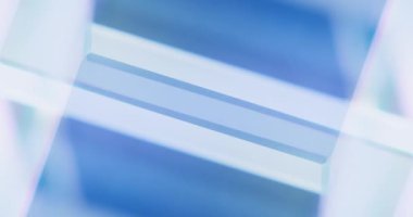 Neon light reflection. Glowing geometric background. Defocused tranquil blue white color illumination abstract free space for logo. Seamless loop rotation. Shot on RED Cinema camera.