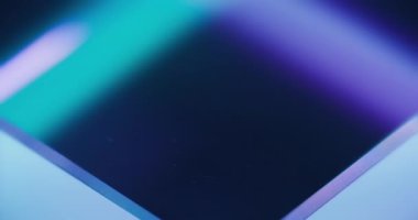 Neon light background for logo. Fluorescent glow. Futuristic illumination. Defocused blue purple color flare abstract copy space. Seamless loop rotation. Shot on RED Cinema camera.