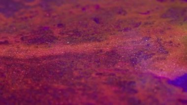 Parıldıyor. Sıvı boya hareketi. Hızlı hareket eden kırmızı akrilik mürekkep.