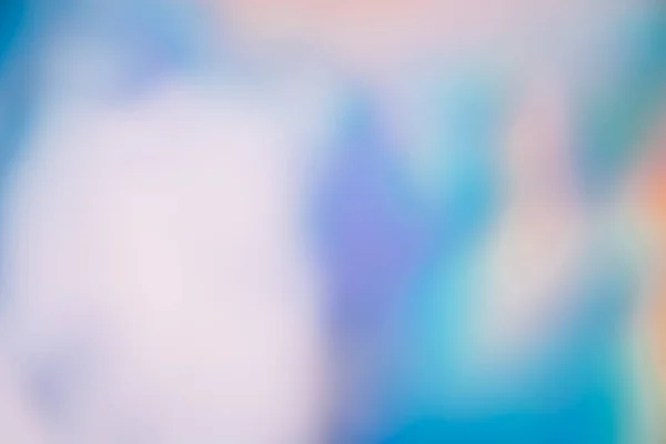 Defocused glow. Iridescent light flare. Holographic optical radiance. Blur orange blue purple white color smooth glare on abstract copy space background.