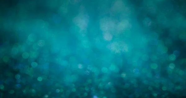 Bokeh light overlay. Blur circles glow. Color particles flare. Defocused green blue round flecks texture decorative abstract background.