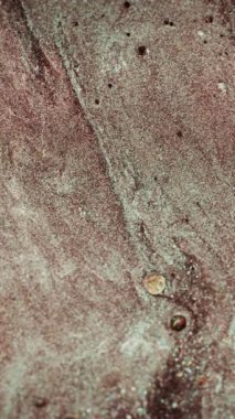 Vertical video. Shimmering texture background. Glitter fluid flow. Shiny particles. Brown white sparkling grain bubbles motion abstract surface. Shot on RED Cinema camera.