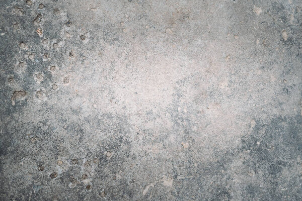 Stony background. Gray concrete texture. Retro wall. Grunge aged surface with damages and holes copy space for text logo.