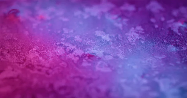 Neon color gradient background. Blur light flare. Futuristic glow. Defocused purple blue pink grain particles flakes texture decorative abstract copy space wallpaper.