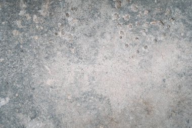 Beton yüzey. Eski bir doku. Aşınma süreci. Hasarlı Grunge gri taşlı arkaplan ve delikler metin logosu için boşluk kopyala.