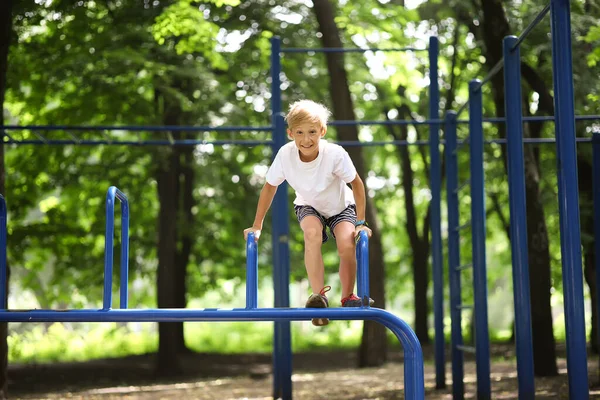 Cheerful Boy Athlete Park Climbed Sports Equipment Laughs Merrily — Stock Photo, Image