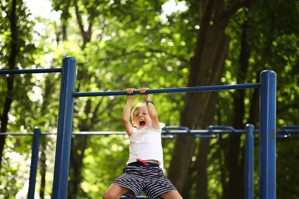 Boy Goes Sports Park Hangs Horizontal Bar Pulls Himself Shouts — Stock Photo, Image