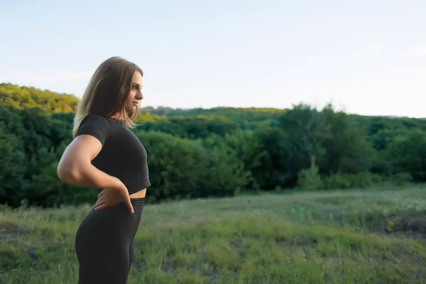 Young Sportswoman Black Tracksuit Keeps Her Hands Her Belt Looks — ストック写真