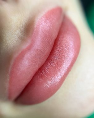 close-up of lips with permanent lip makeup procedure macro shot of lips with eyebrow tattoo
