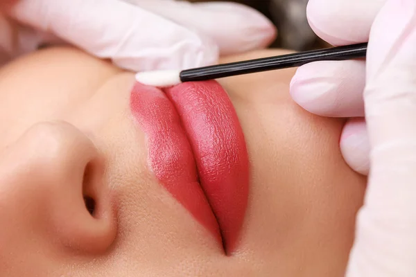 perfectly executed permanent lip makeup using machine technique with red pigment