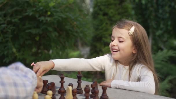 Portrait Smiling Little Girl Chess Player Playing Outdoor Cheerful Smart — стоковое видео