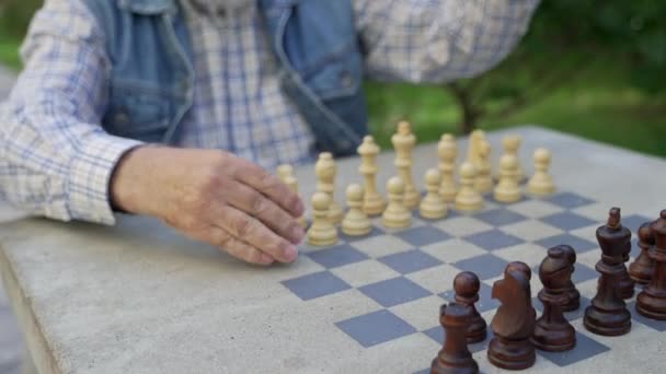 Zoom Out Senior Grandfather Offers Grandson Choose Color Chess Pieces — Wideo stockowe