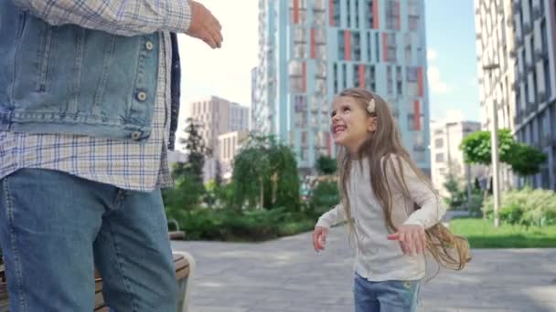 Adorable Happy Little Girl Dancing Active Retired Grandpa Middle Street — Vídeo de stock