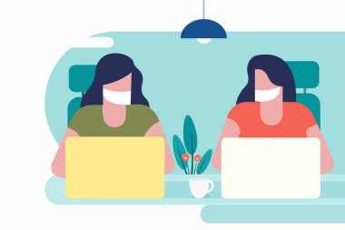 Dizüstü bilgisayar kullanan maskeli kızlar