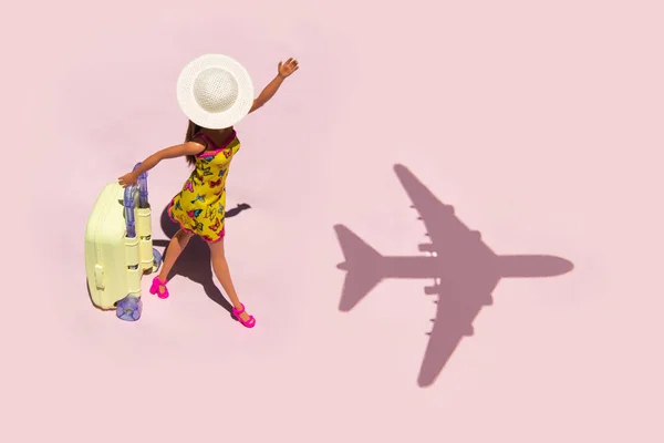 Creative lost chances concept. Minimal travel composition. Late for airplane on pastel light pink background.