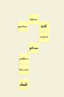 question mark made with sticky notes with messages on white background
