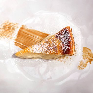 top view of piece of cheesecake decorated with caramel