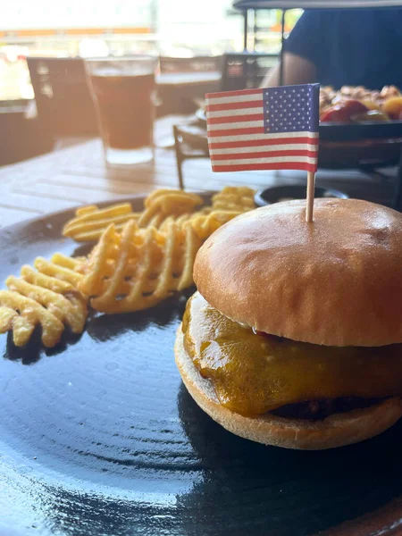 hamburger on restaurant table with american flag. American fast food