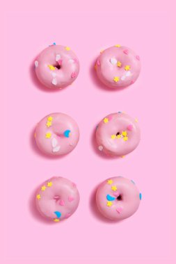 minimalist background with pink donuts
