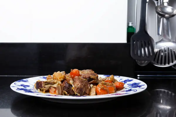 Homemade dish prepared of beef Ragout with vegetables. Homemade food concept.