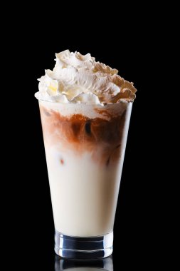 Glass of coffee with ice and whipped cream isolated on black background