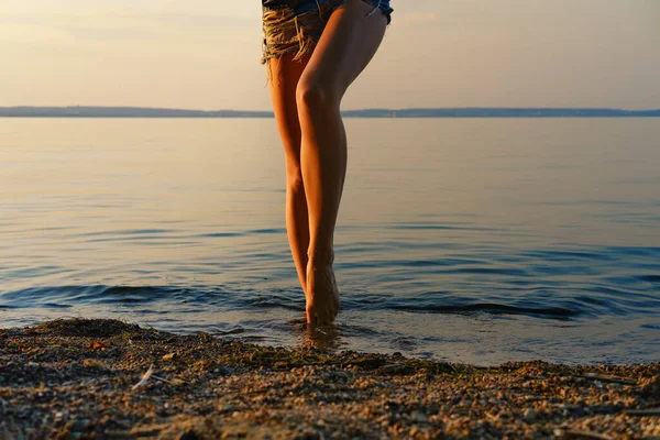 Cropped Image Barefoot Woman Getting Out Water Beach Sunset Time — Stok fotoğraf