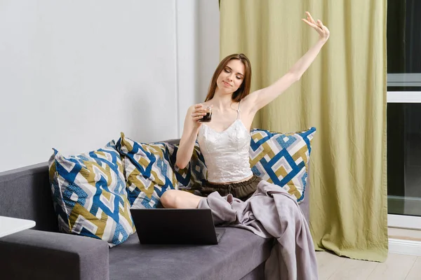 Young Carefree Woman Sitting Couch Cup Coffee Home Weekend Watching Royalty Free Stock Photos