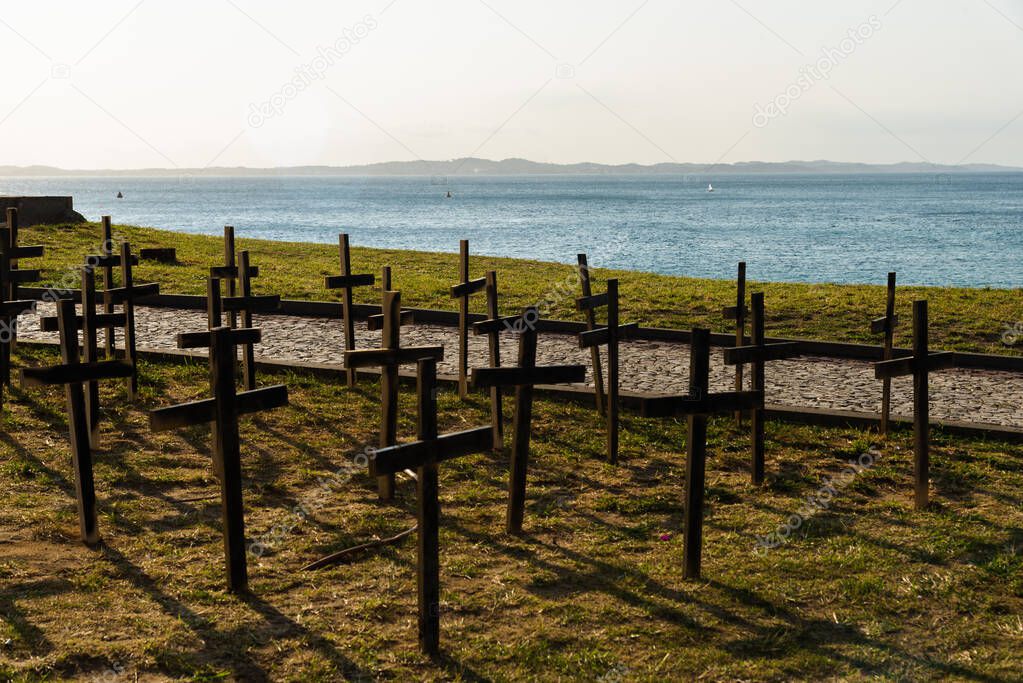 Crosses fixed to the ground in honor of those killed by covid-19. Salvador, Bahia, Brazil.