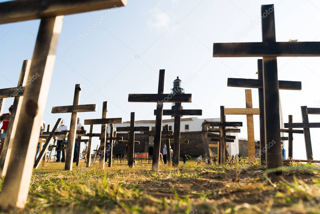 Salvador, Bahia, Brazil - October 01, 2021: Crosses fixed to the ground in honor of those killed by Covid-19 at Farol da Barra in Salvador, Bahia, Brazil.