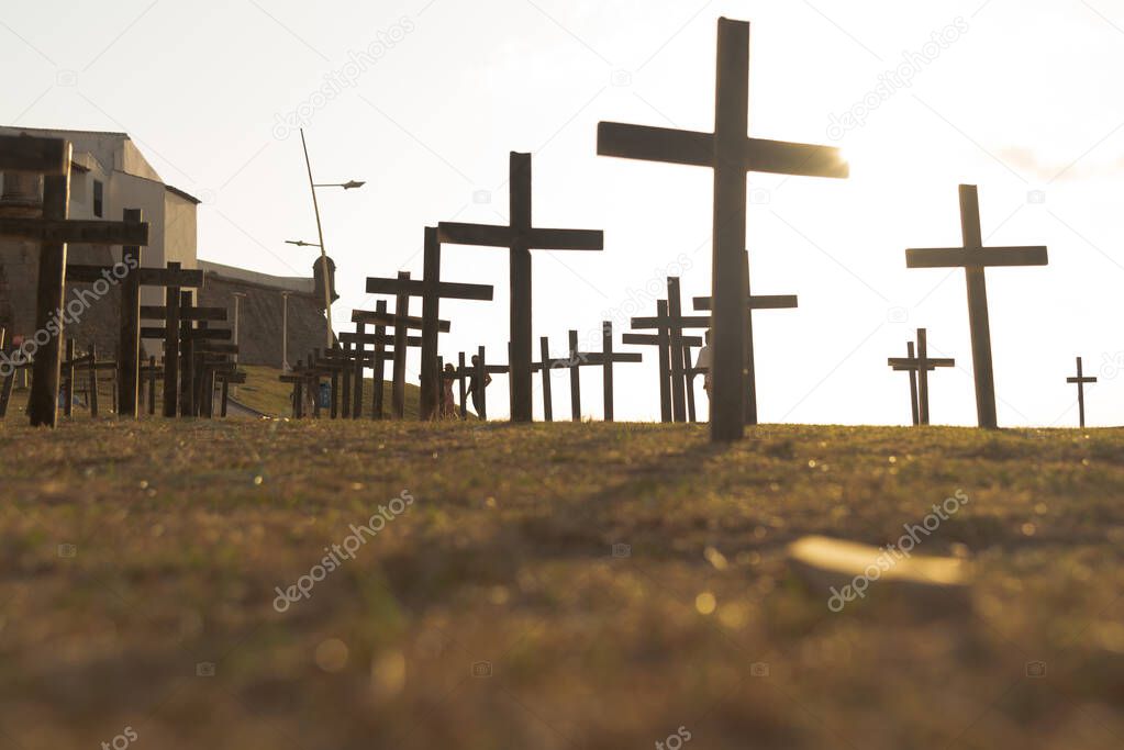 Salvador, Bahia, Brazil - October 01, 2021: Crosses fixed to the ground in honor of those killed by Covid-19 at Farol da Barra in Salvador, Bahia, Brazil.