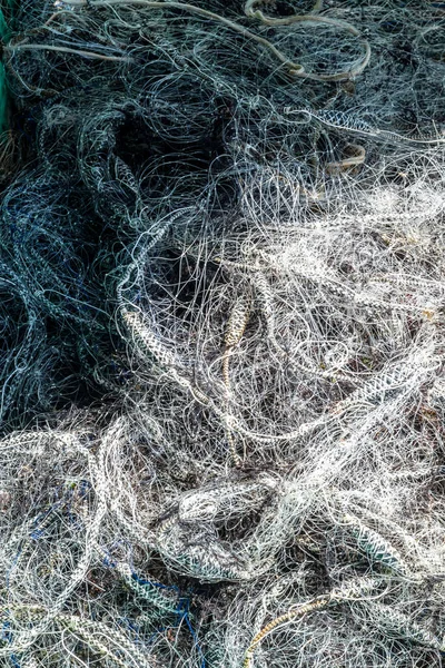 Detail of a fisherman\'s net on the ground. City of Salvador, capital of Bahia, Brazil.