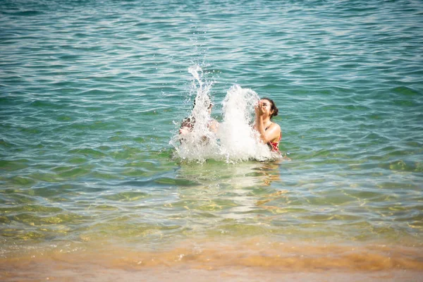 Two Women Splashing Water Beach Porto Barra Salvador Bahia — Stok fotoğraf