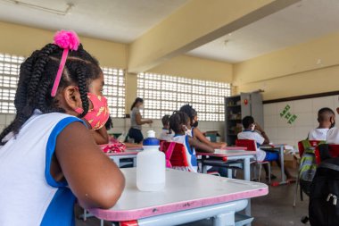 Salvador, Bahia, Brazil - October 14, 2021: Students studying in a classroom after returning to face-to-face classes during the coronavirus pandemic in Salvador, Bahia.