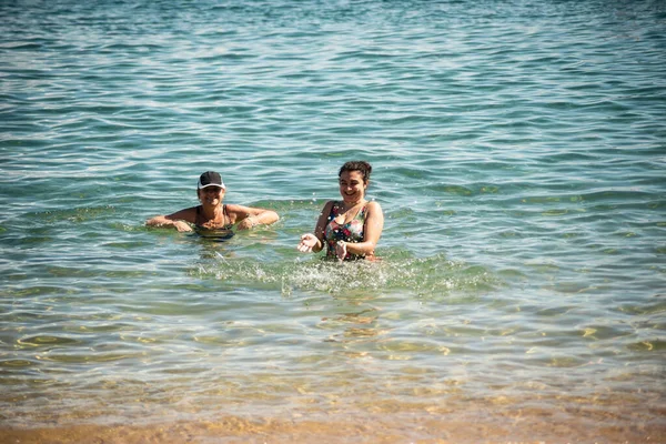 Two Women Splashing Water Beach Porto Barra Salvador Bahia — Stock Photo, Image