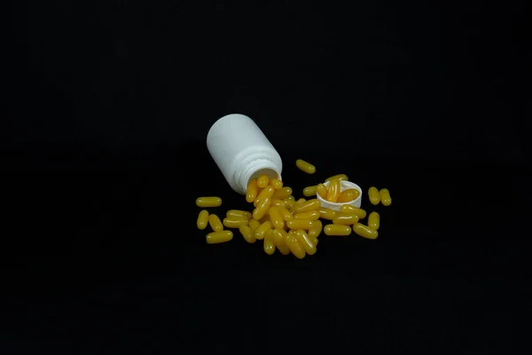 Some Yellow Fatty Acid Pills Isolated Black Background — Foto de Stock