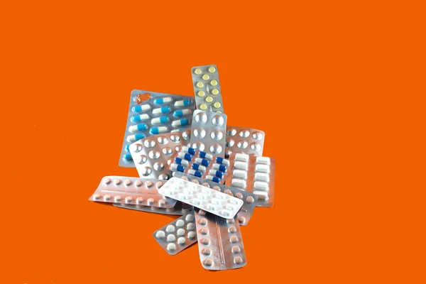 Carton Different Pills Medicines Pills Stacked Orange Background Medical Supplies — Foto de Stock