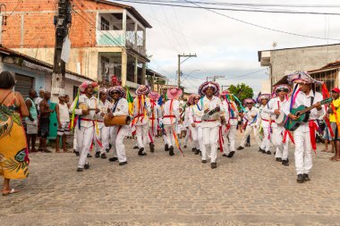 Saubara, Bahia, Brazil - August 06, 2022: Members of the Marujada de Curaca dance and sing at the Chegancas cultural meeting in Saubara, Bahia.