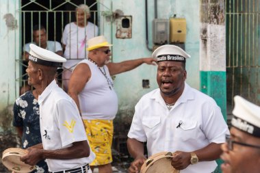 Saubara, Bahia, Brazil - August 06, 2022: Members of Marujada Fragata Brasileira parade and play percussion instrument at the Chegancas cultural meeting in Saubara, Bahia.
