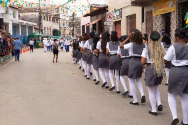 Saubara, Bahia, Brazil - August 06, 2022: Members of Cheganca de Mouros Barra Nova Feminina parading in line at the Chegancas cultural meeting in Saubara, Bahia.