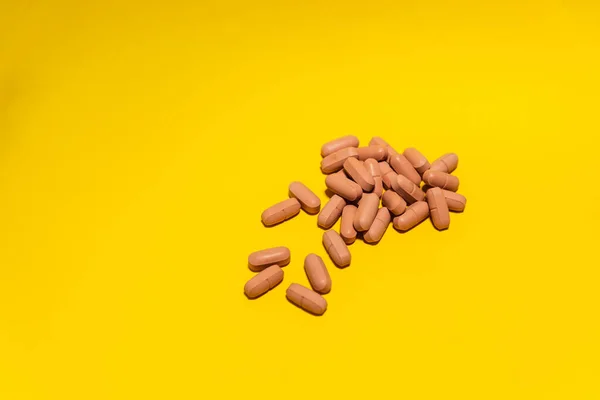 Several Brown Colored Pills Laid Out Top Blue Surface Medical — Stock fotografie