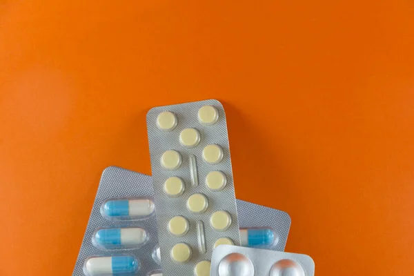 Carton Different Pills Medicines Pills Stacked Orange Background Medical Supplies — Foto de Stock