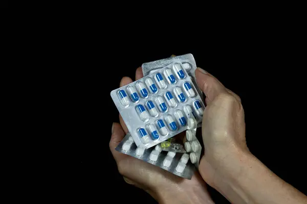 Hands Hold Pill Packs Assorted Colors Black Background Medical Material — Foto Stock